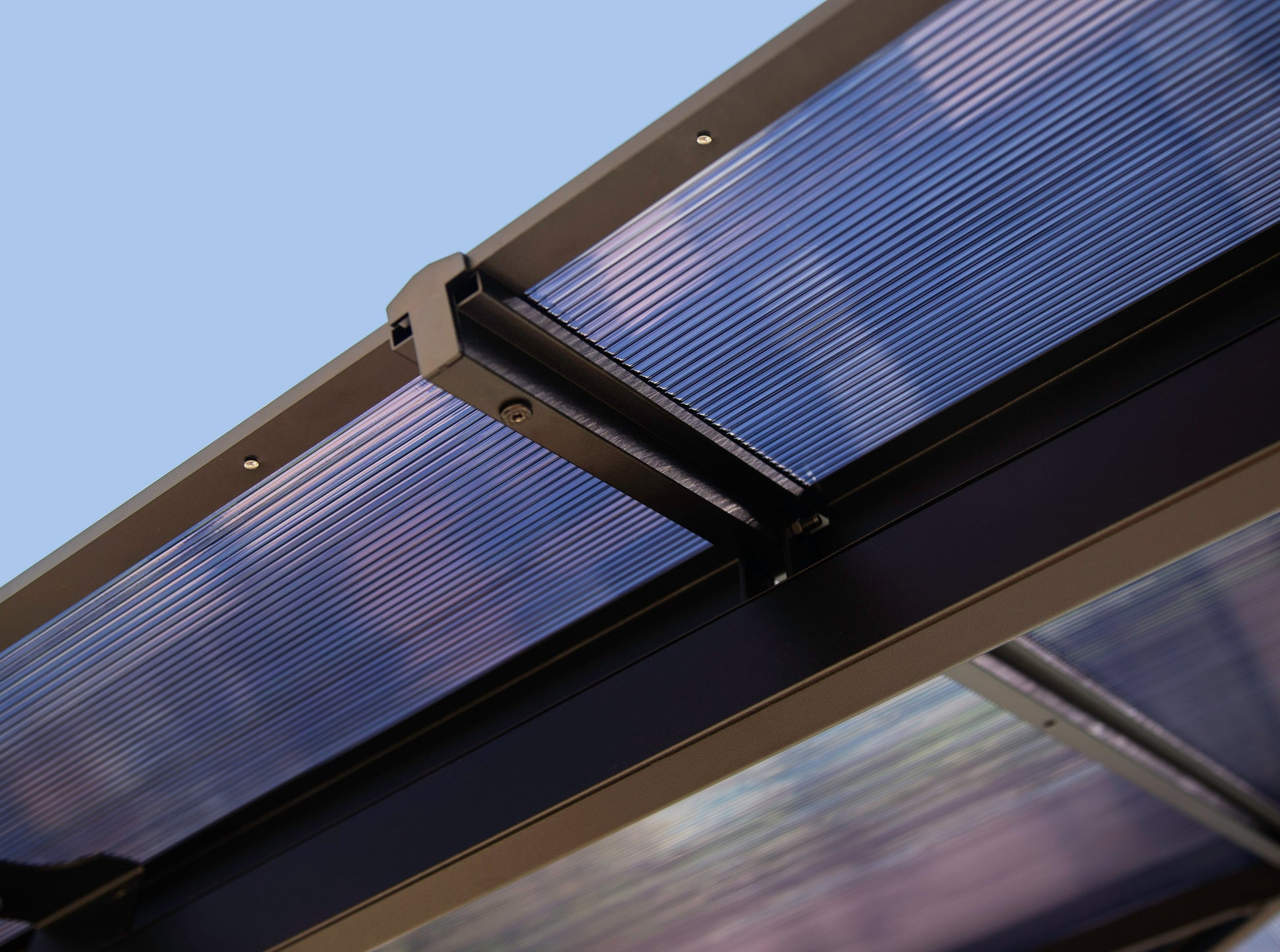 Close up of transparent Madrid Hard Top Gazebo roof.