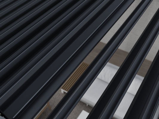 Close-up of black louvers on the roof of a louvered pergola.