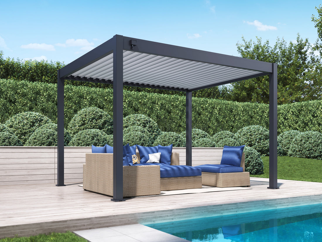 louvered pergola with blue couches by a pool