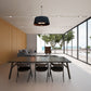 Glow Infrared pendent heat lamp hanging from ceiling over dining table