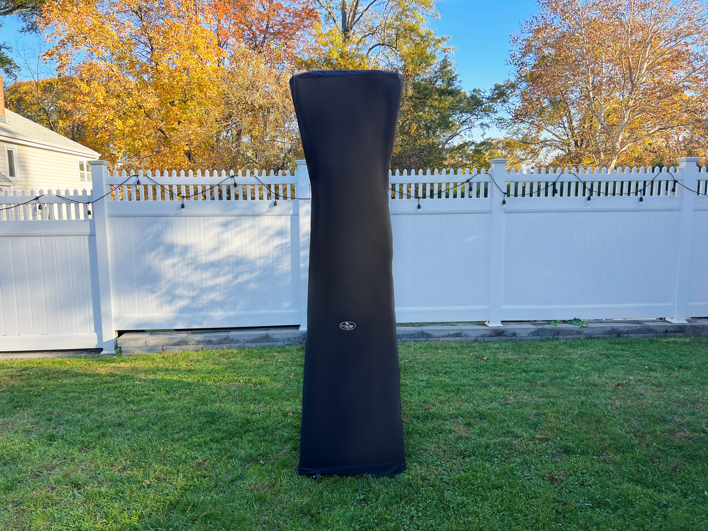 Elevate Propane Heater with cover in backyard durng fall