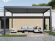A contemporary Lugano louvered pergola made of aluminum, featuring a contemporary design with adjustable louvered roof, in a backyard setting with outdoor furniture below.