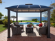Cambridge Hard Top Gazebo on brick patio with outdoor furniture underneath.