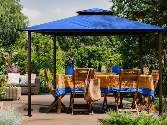 Kingsbury Soft Top Gazebo in Mediterranean Blue Canopy Roof with outdoor dining table.