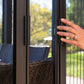 Close up of woman's hand opening the doors of the Siena Hard Top Gazebo.