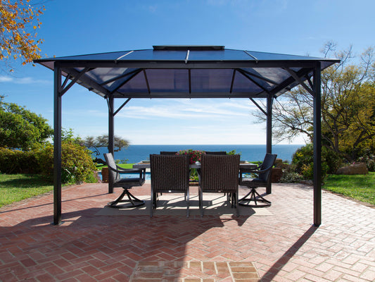 Madrid Hard Top Gazebo on brick backyard patio overlooking the ocean.